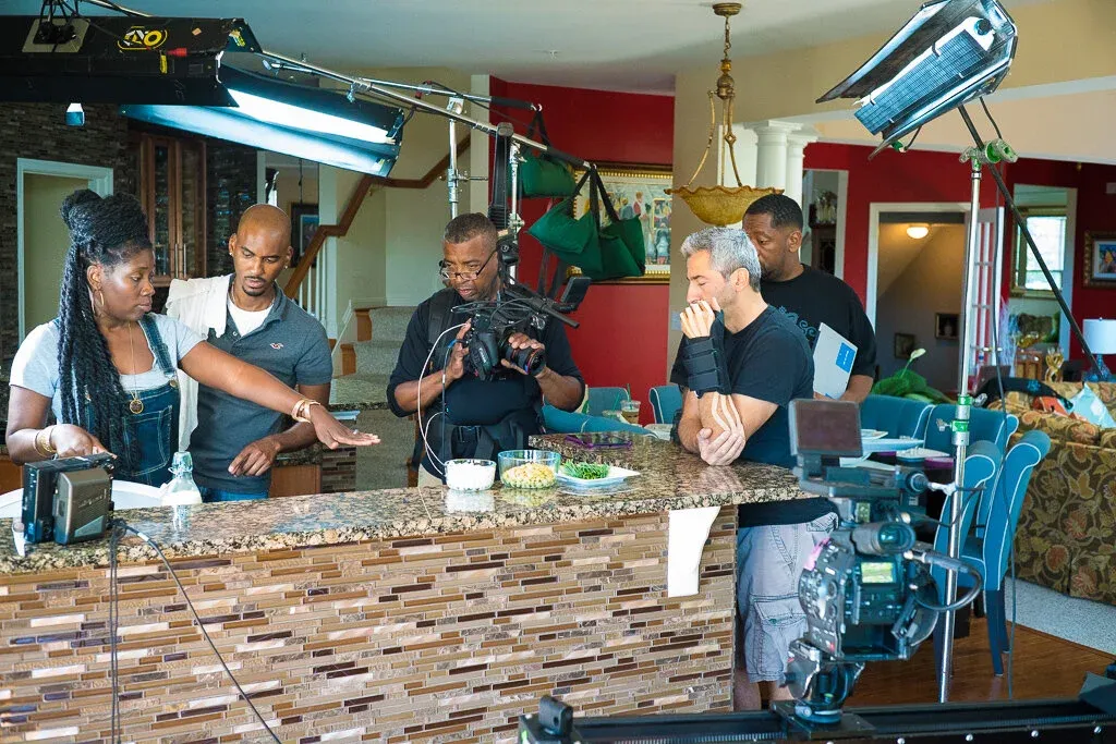 Nakia P. Williams directing a cooking segment on set